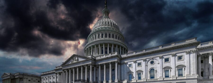 The US Capitol Building in Washington, DC, USA, against a stormy sky